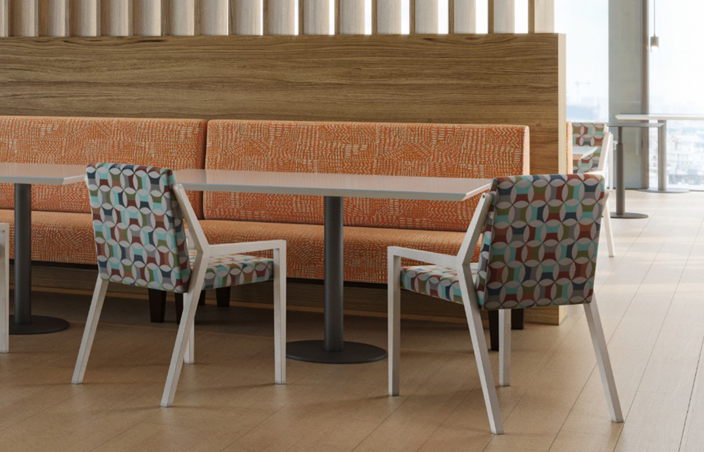 Shelby Williams patterned chairs and orange banquette in a hospitality setting